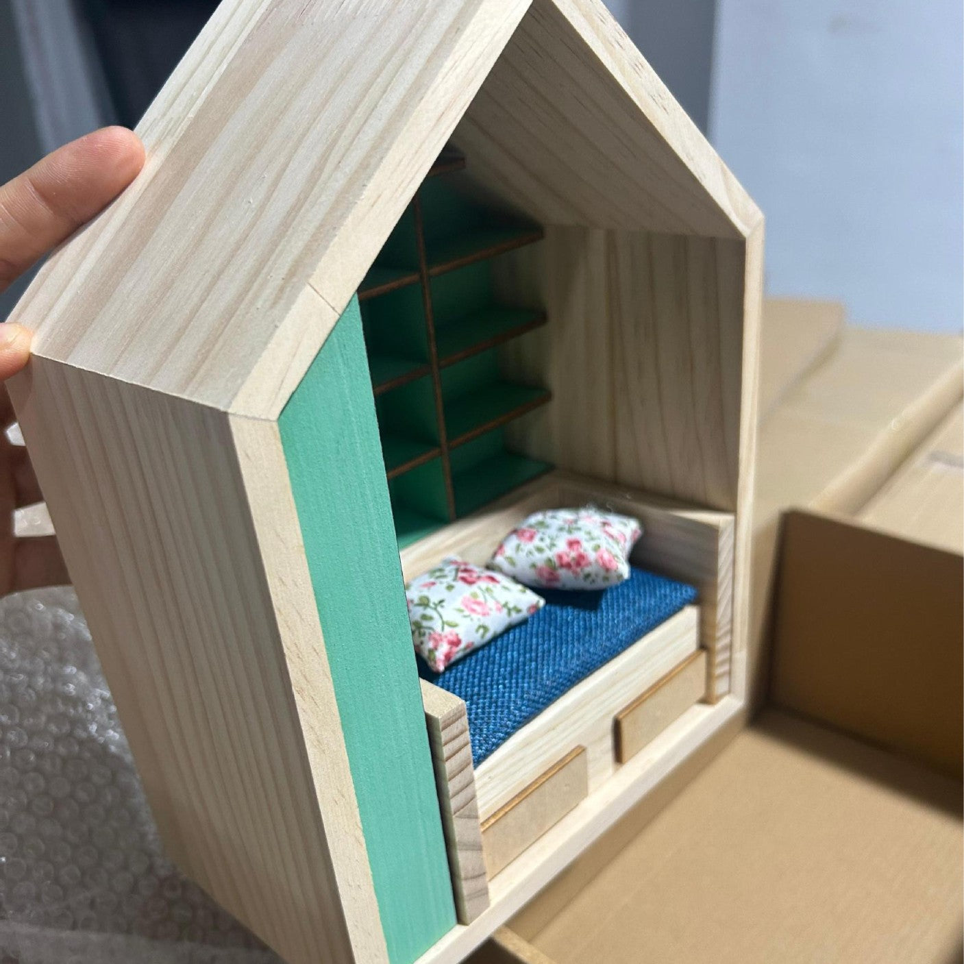Miniature Anxiety Bookcase – An antique-style bookstore with tiny books